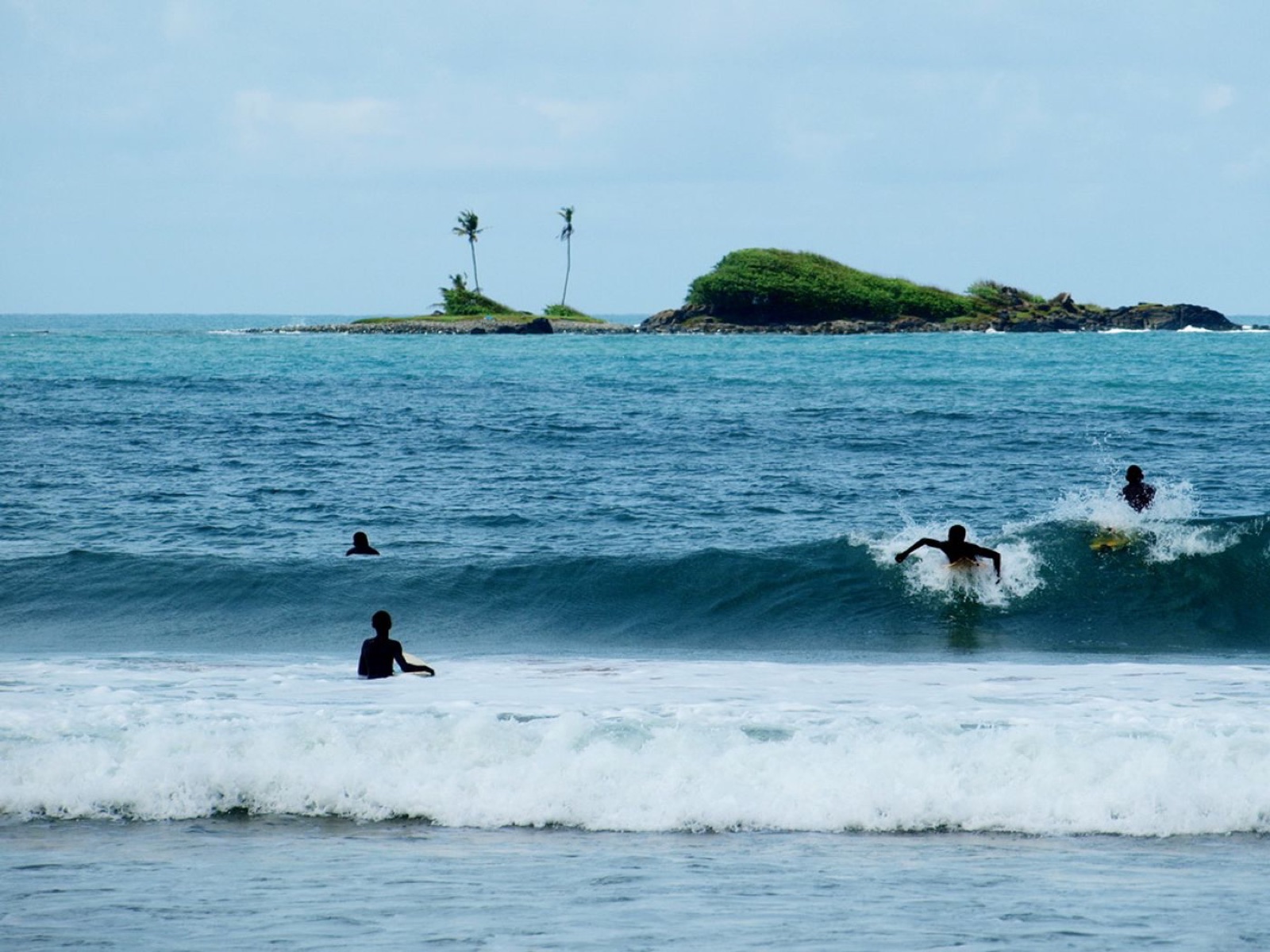 Surfers at Busua Beach on Ghana's western coast