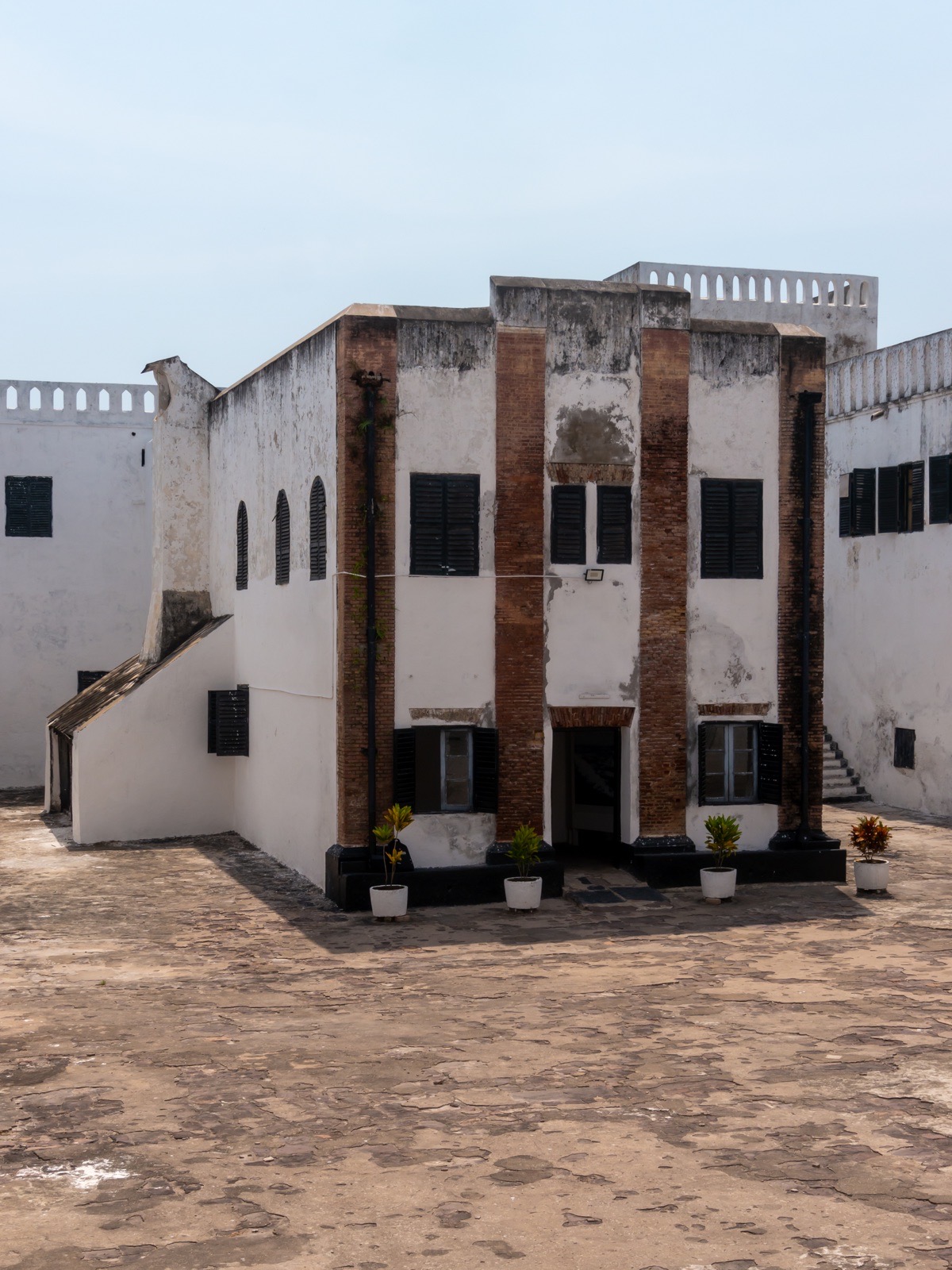 White stone walls of Elmina Castle beside the Atlantic coast